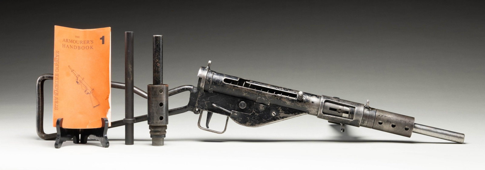 FULLY TRANSFERABLE STEN MK2 SUBMACHINE GUN.: Cal. 9mm (Luger). S# IRS2901. Bbl. 7 3/4". Triangular blade front sight. Fixed aperture rear sight. The Sten gun was the standard SMG of the British military during WW2. This particular gun appears de