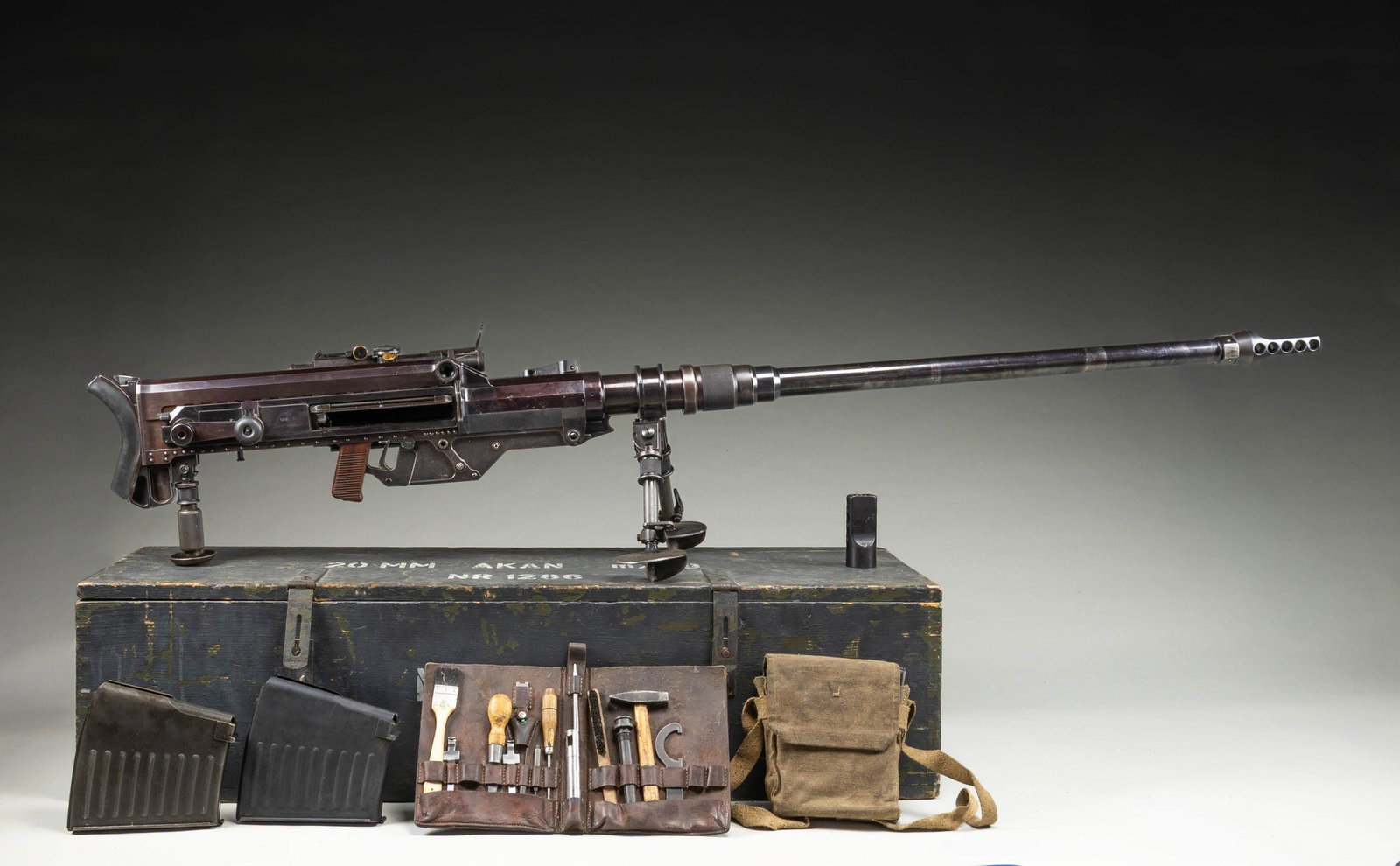 SOLOTHURN S18-1000 ANTI TANK RIFLE.: Cal. 20mm. S# 1286. Bbl. 51 1/2" with muzzle brake. Flip up blade front sight. Tangent rear sight graduated to 1500m. Integral scope with post reticle & green tinted optics. All visible matching numbe