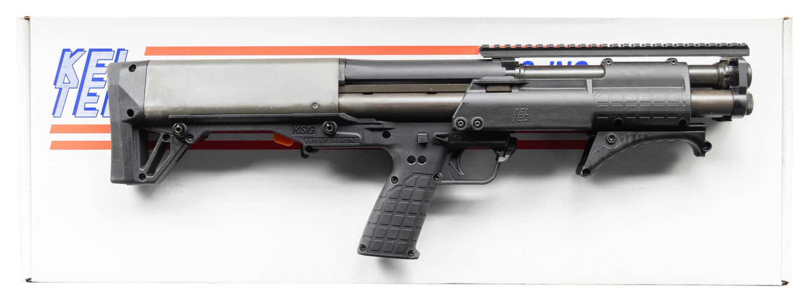 NEAR NEW KEL-TEC KSG PATROL MODEL SHORT BARREL: PUMP ACTION BULLPUP SHOTGUN WITH BOX. Cal. 12 GA, 3". S# X3F92. Bbl. 16". KSG Patrol Model short barreled pump action bullpup shotgun mfg. by Kel-Tec. Lower exhibits standard markings denoting Kel-Tec