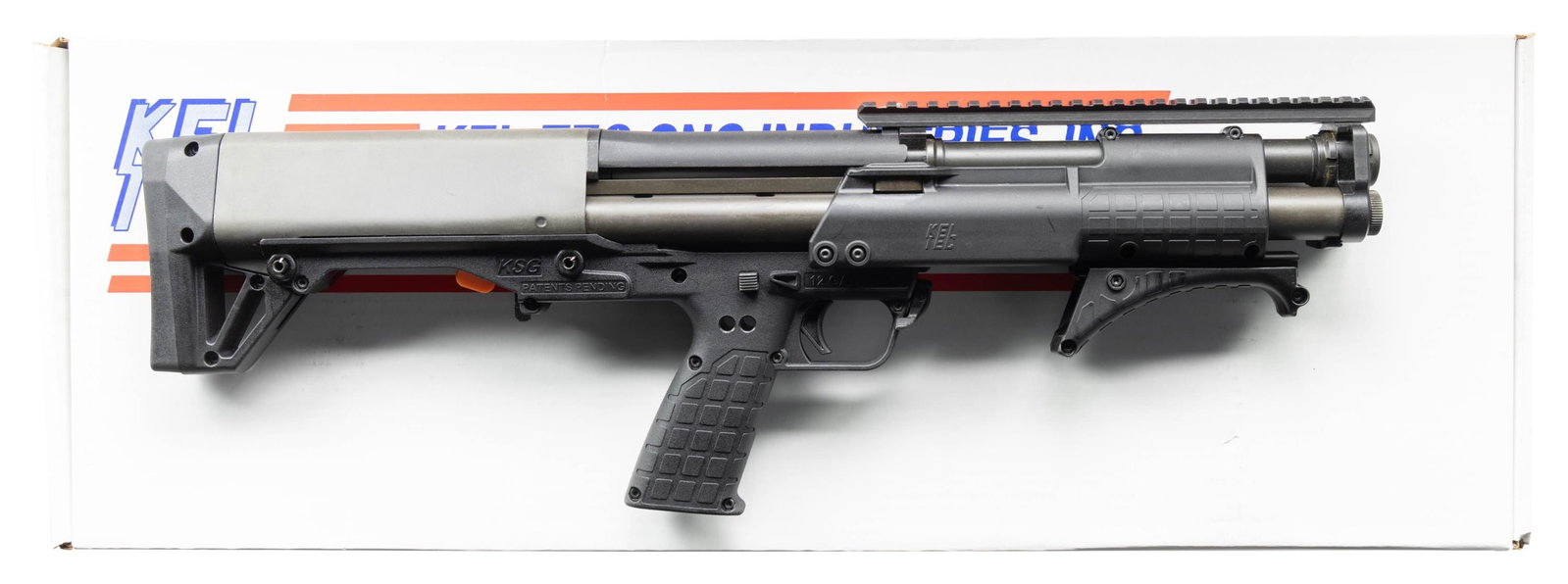 NEAR NEW KEL-TEC KSG PATROL MODEL SHORT BARREL: PUMP ACTION BULLPUP SHOTGUN WITH BOX. Cal. 12 GA, 3". S# X3F93. Bbl. 16". KSG Patrol Model short barreled pump action bullpup shotgun mfg. by Kel-Tec. Lower exhibits standard markings denoting Kel-Tec