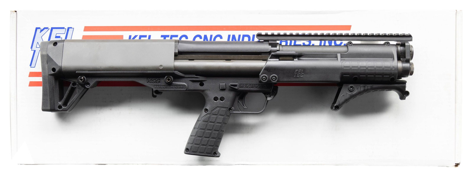 KEL TEC PATROL SHORT BARREL PUMP ACTION SHOTGUN.: Cal. 12 Ga. 3". S# X3F17. Bbl. 13 3/4". Top mounted picatinny rail for sight mounting. Unique bullpup short barreled shotgun made by Kel-Tec with dual mag tubes for total of 10 rd. capacity with 2 3/4
