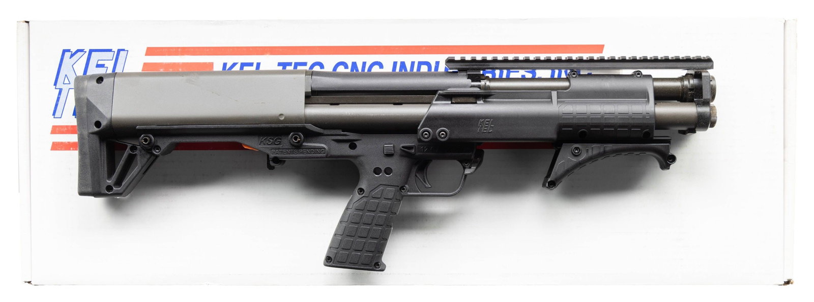 KEL TEC PATROL SHORT BARREL PUMP ACTION SHOTGUN.: Cal. 12 Ga. 3". S# X3F18. Bbl. 13 3/4". Top mounted picatinny rail for sight mounting. Unique bullpup short barreled shotgun made by Kel-Tec with dual mag tubes for total of 10 rd. capacity with 2 3/4