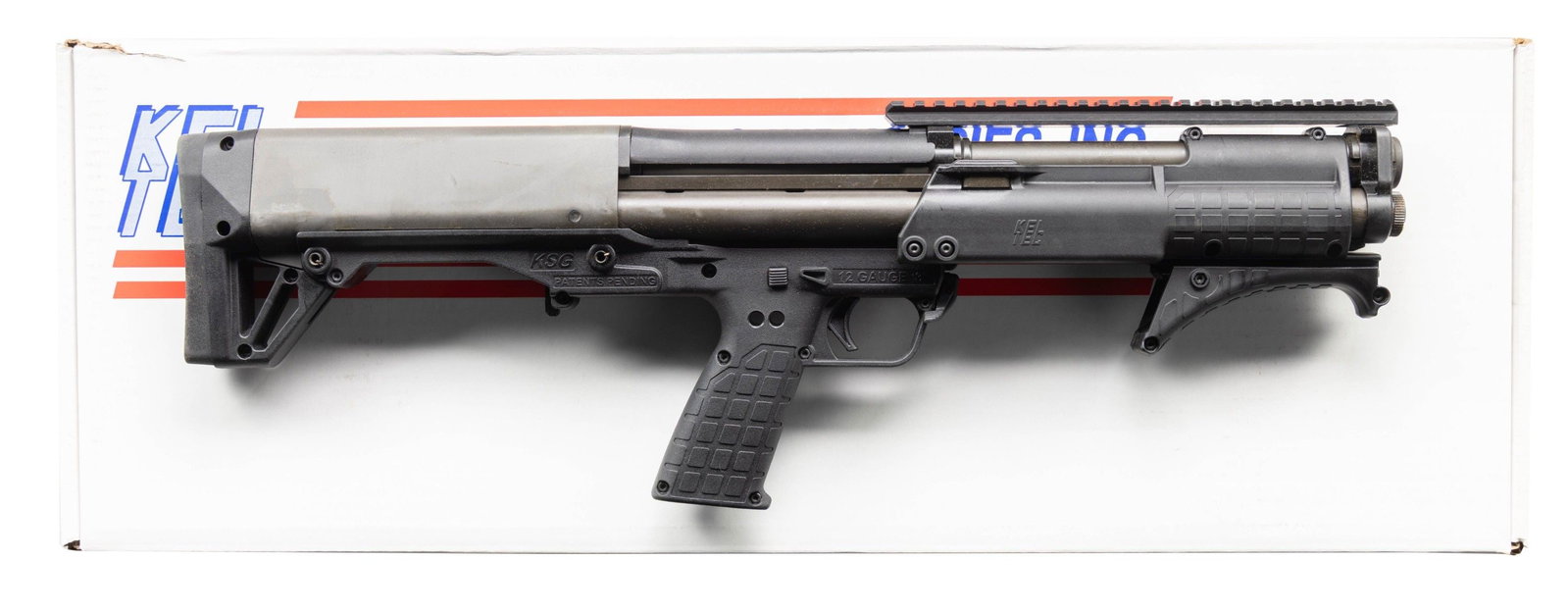 KEL TEC PATROL SHORT BARREL PUMP ACTION SHOTGUN.: Cal. 12 Ga. 3". S# X3F94. Bbl. 13 3/4". Top mounted picatinny rail for sight mounting. Unique bullpup short barreled shotgun made by Kel-Tec with dual mag tubes for total of 10 rd. capacity with 2 3/4