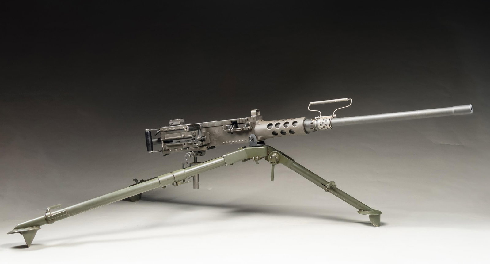 VERY CLEAN TNW M2HB "MA DEUCE" 50 CALIBER SEMI-: AUTOMATIC RIFLE WITH TRIPOD AND ACCESSORIES. Cal. 50 BMG. S# 000313. Bbl. 45". The Browning M2HB, affectionately referred to in military circles as "Ma Deuce" is another evolution of the successful Jo