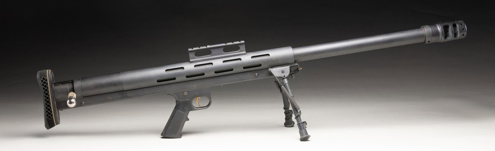 L.A.R. INC. GRIZZLY BIG BOAR BOLT ACION RIFLE.: Cal. 50 BMG. S# X002118. Bbl. 36 1/4" with 1 in 15" twist rate plus multi-port machined muzzle brake adding 2 3/4". Mfg. 1994-2011 as single shot bullpup having an overall length of 45.5" and weight o