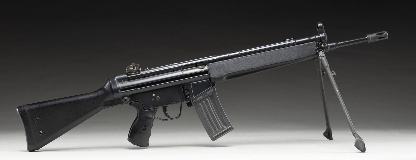 PRE-BAN H&K 93 SEMI AUTO RIFLE.: Cal. 223. S# A133450. Bbl. 16 1/2". Standard H&K style sights with drum adjustable rear. Semi auto version of the HK33 roller locked rifle. Left side of mag well has "IC" date code for 1982