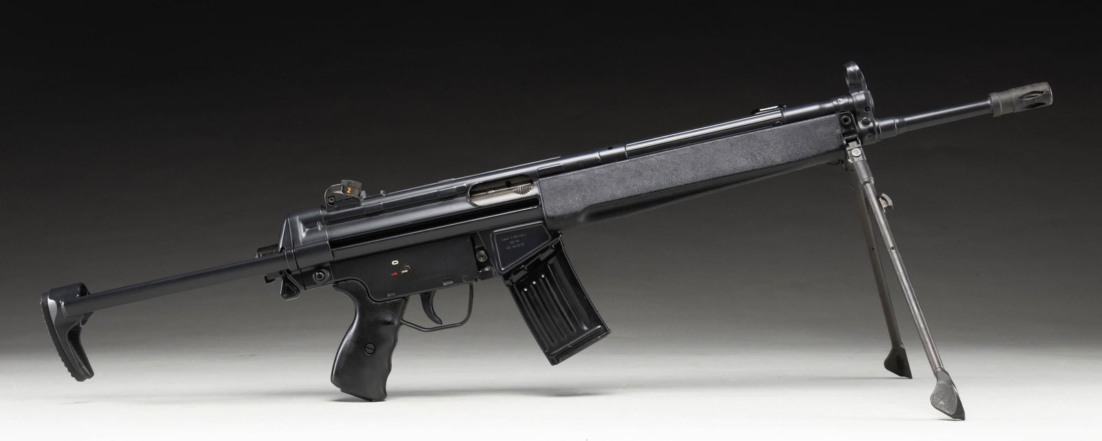 PRE-BAN H&K 93 SEMI AUTO RIFLE.: Cal. 223. S# A130245. Bbl. 16 1/2". Standard H&K style sights with drum adjustable rear. Semi auto version of the HK33 roller locked rifle. Left side of mag well has "IB" date code for 1981