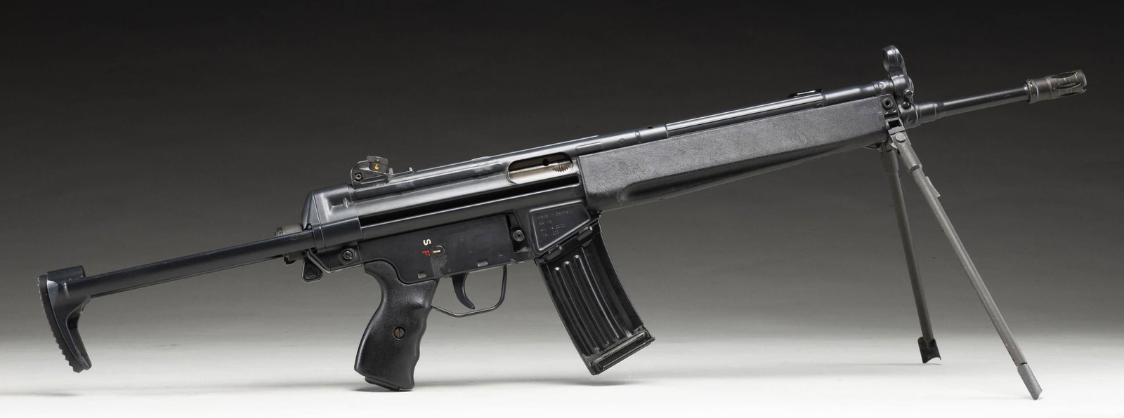PRE BAN H&K 93 SEMI AUTO RIFLE.: Cal. 223. S# A124848. Bbl. 16 1/2". Standard H&K style sights with drum adjustable rear. Semi auto version of the HK33 roller locked rifle. Left side of mag well has "IA" date code for 1980 production