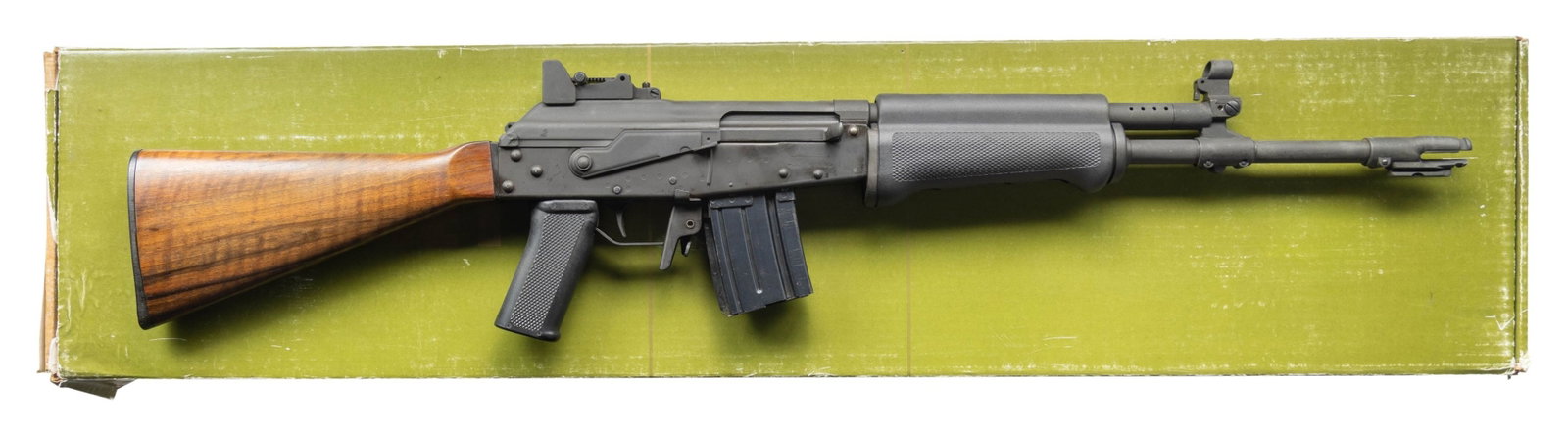 PREBAN VALMET M76 SEMI AUTO RIFLE.: Cal. 223 (Rem). S# 157099. Bbl. 16" with flash hider. Hooded front sight with folding night sight. Aperture rear sight graduated to 600m. High quality Finnish made Kalashnikov style rifle. Parkerized