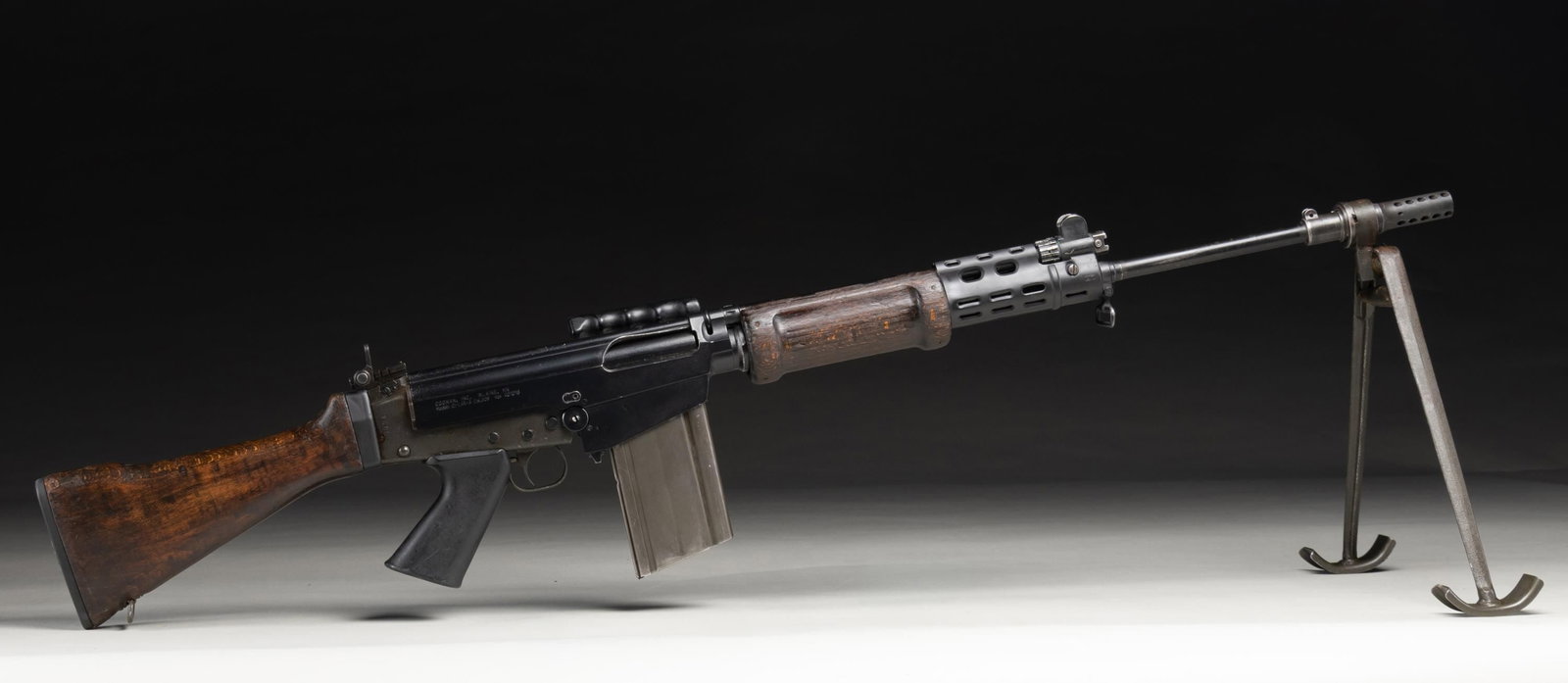 COONAN CI-LAR-3 SEMI AUTO RIFLE.: Cal. 308 Win. S# 401016. Bbl. 21" with muzzle brake. Post front sight with protective ears. Adjustable aperture rear sight. Israeli parts FAL built on a Coonan receiver. Metal has mix of parkerized &