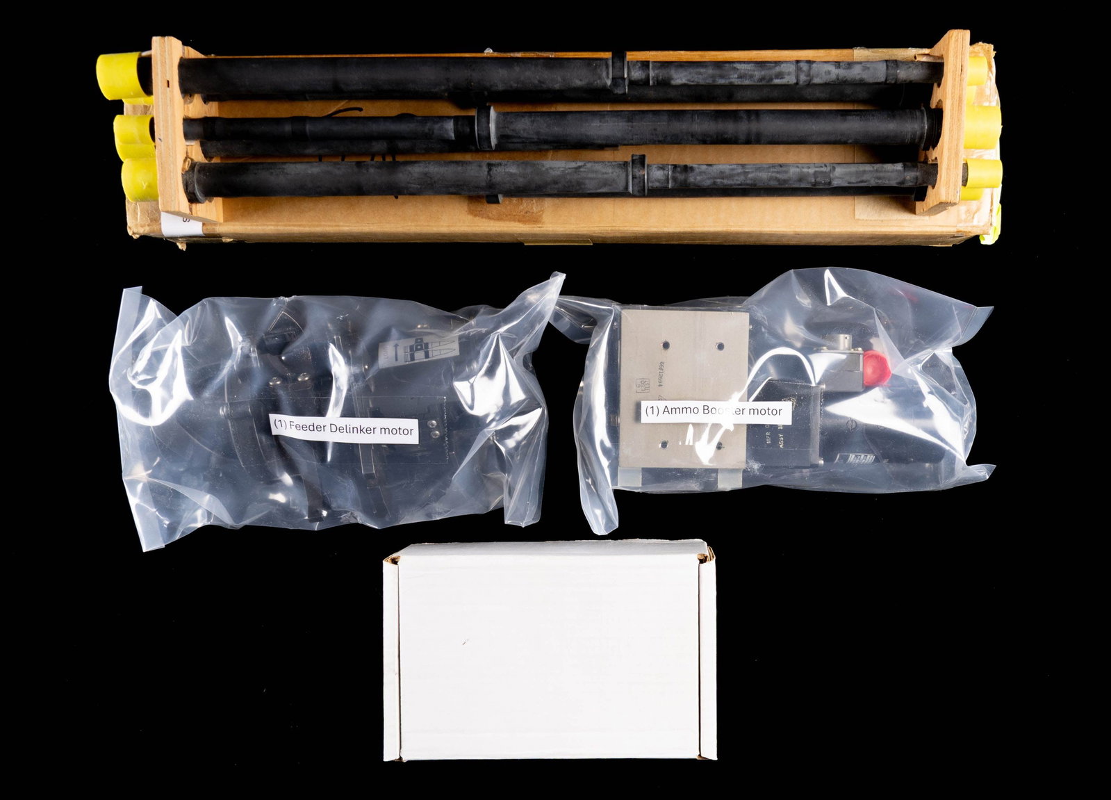 DESIRABLE GROUPING OF ELUSIVE M134 MINI GUN PARTS: A collection of M134 Minigun parts including the following: 1 Feeder / De-Linker Motor, 1 Ammo Booster Motor, 6 new M134 barrels, 6 Dillon Aero Bolt assemblies, 6 General Electric Bolt assemblies, 12 