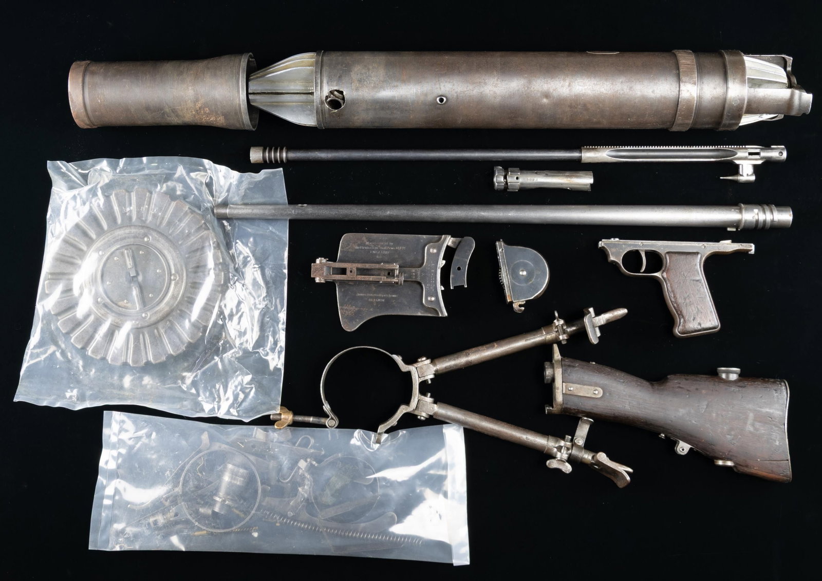 BSA LEWIS GUN PARTS KIT.: Ex-Irish army BSA Lewis gun parts kit. The "A" prefix on top cover & bbl. denotes ex-Irish issue. Parts include butt stock assembly, 47 rd. drum, bbl. with cooling jacket, bipod, part of the top cover
