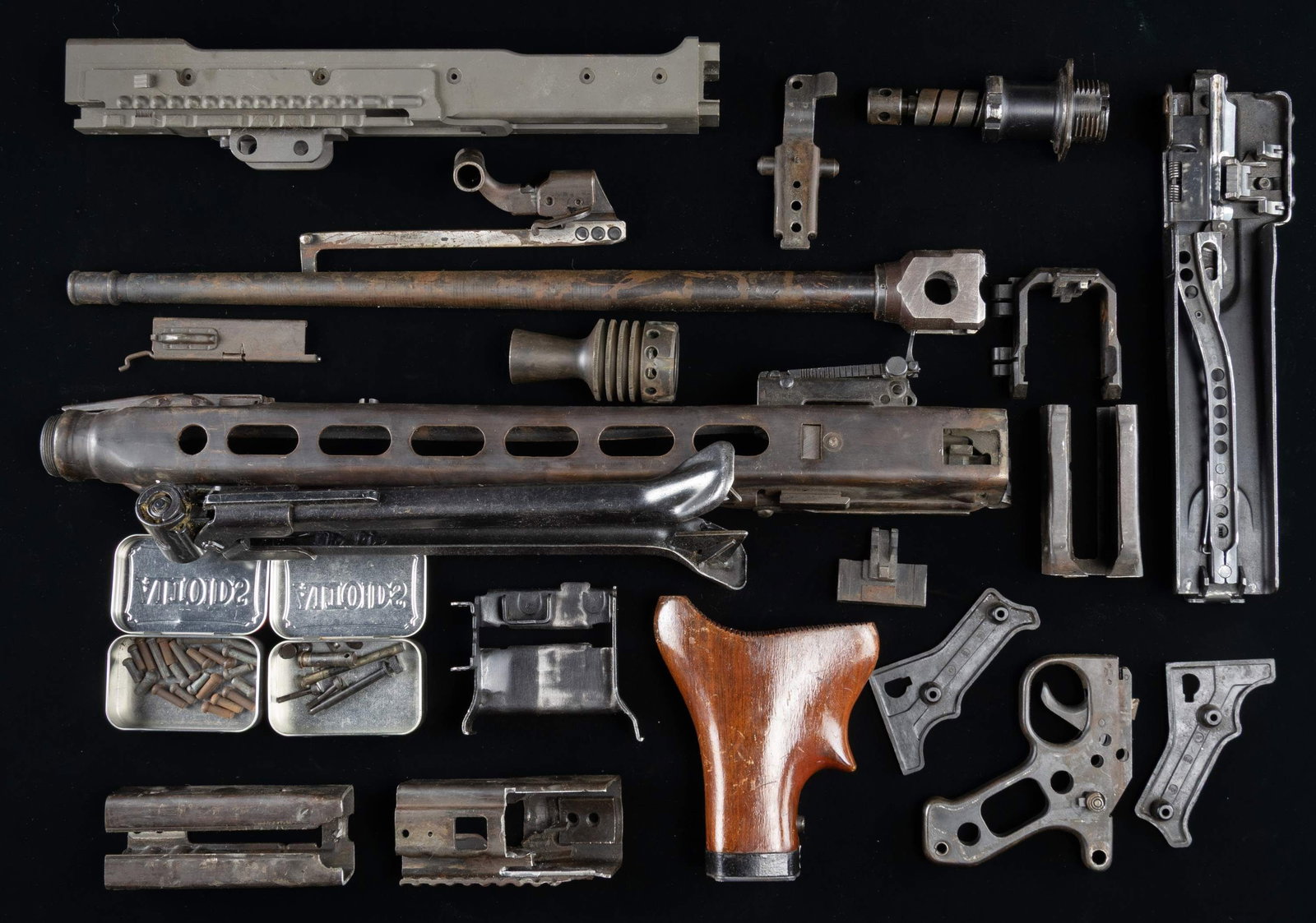 GERMAN MG-42 PARTS KIT WITH DUMMY RECEIVER.: This lot consists of several MG-42/MG3 parts such as a WW2 top cover coded "cof", a postwar 7.62 NATO bbl., a "cof" coded WW2 trigger guard assembly, an unmarked hardwood buttstock assembly, a "bpr" c