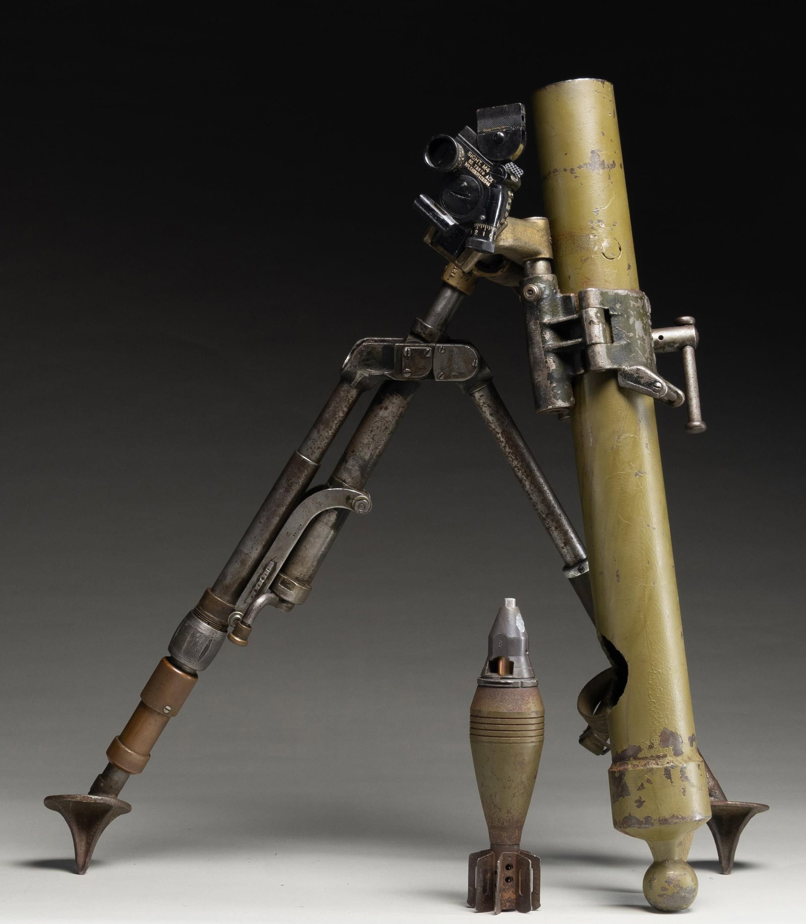 60MM MORTAR DEWAT WITH BIPOD, SIGHT & ROUND FOR: DISPLAY. 60mm mortar in display condition. Properly dewatted w/ steel pin through bore & hole cut at base of tube. 26.25" overall length. Bipod & sight included as well as display round. CONDITION: