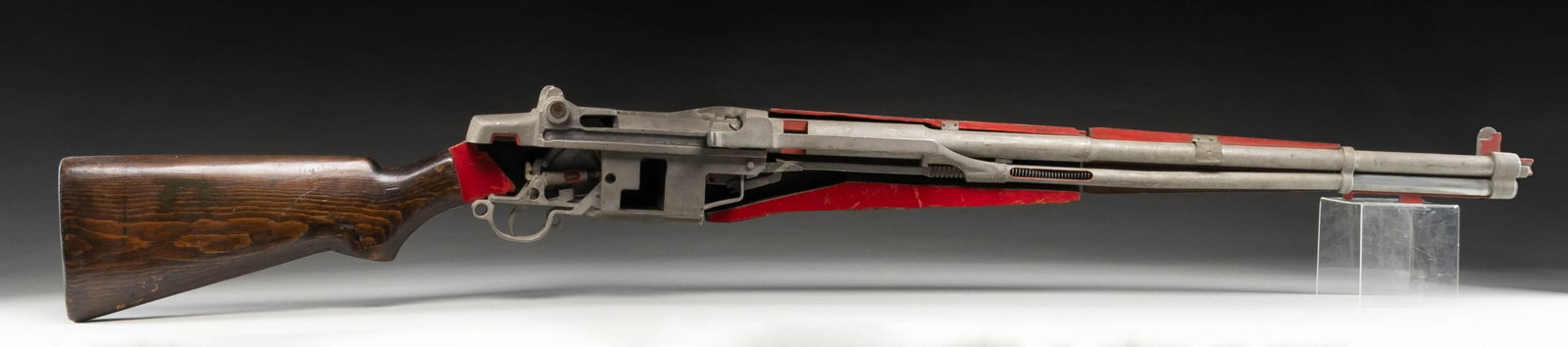 OVERSIZED CUTAWAY M1 GARAND TRAINING MODEL.: Overall: 7 feet, 2.5 inches. Cutaway training model of the M1 Garand, used for teaching about function, cycling & internal parts. CONDITION: appears good overall appearing to have all original compone