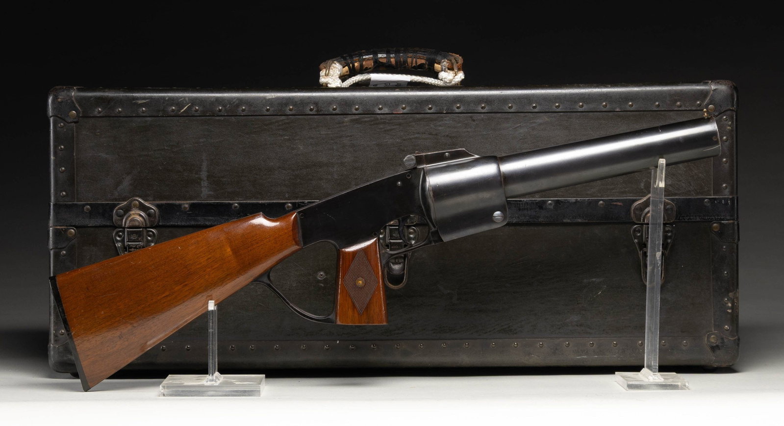 FEDERAL LABORATORIES GAS GUN.: Cal. 37mm. Bbl. 12". Brass post front sight. V-notch rear sight. Black enamel finish. Checkered hardwood pistol grip & plain butt stock. UNATTACHED ACCESSORIES: factory case with labels present inside