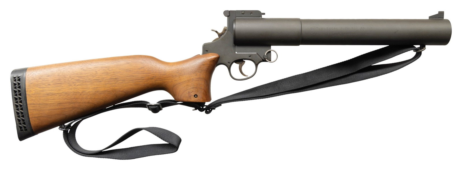 SMITH & WESSON CHEMICAL COMPANY M210/276 GAS RIOT: GUN. Cal. 37mm. S# 6486. This stocked example was part of the line produced by S&W after the decision to re-brand the Lake Erie Chemical Co after it was purchased as part of the Bangor Punta acquisiti