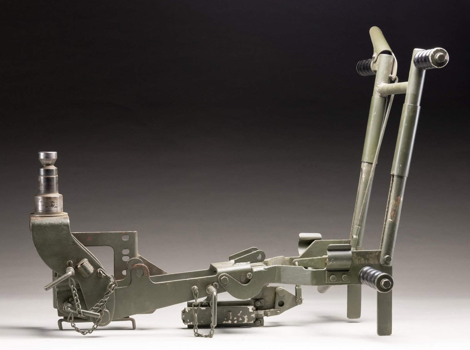 M63 CRADLE MOUNT.: M63 AA mount head frame with pintle for M2 .50 Cal MG. Legs & base parts not included. Green paint finish. CONDITION: item shows scattered flaking green paint & some oxidation. PROVENANCE: Military Mu