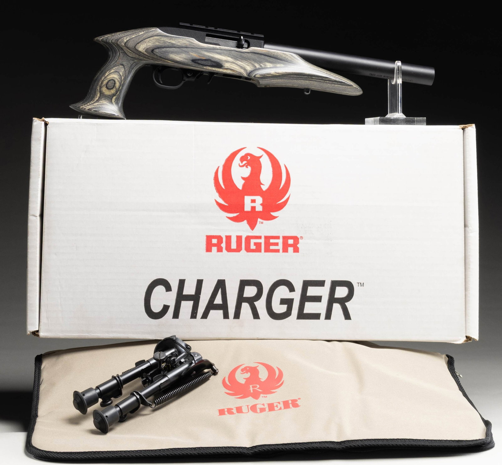 NEW RUGER 22 CHARGER SEMI-AUTOMATIC PISTOL: WITH INTEGRAL AWC ULTRA II SILENCER & ACCESSORIES. Cal. 22 (22 LR). S# 490-12825 (receiver) 080777 (silencer). Bbl. 10" (with silencer). 22 Charger semi-automatic pistol mfg. by Ruger and subsequently