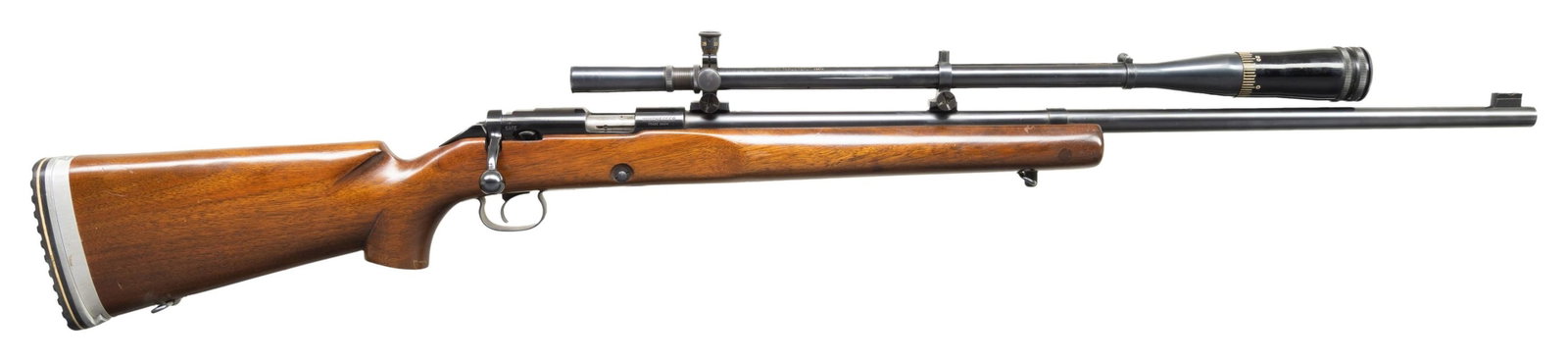 CUSTOM WINCHESTER MODEL 52C TARGET BOLT ACTION: RIFLE. Cal. 22 LR. S# 92820C. Bbl. 28". Rifle is sighted with a Lyman Super Target Sport scope on blocks. Additional block present slightly behind muzzle. Left rear receiver holes are vacant. Blued fi