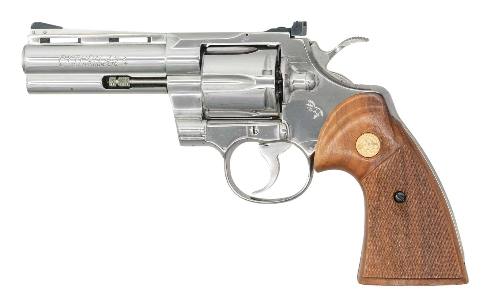 4" NICKEL COLT PYTHON DOUBLE ACTION REVOLVER.: Cal. 357 Mag. S# V60261. Mfg. 1979. Over 51,000 Pythons were mfg in the year 1979 as popularity for the revolver began to soar. This example has a 4" VR bbl with pinned blade front sight. Rear sight