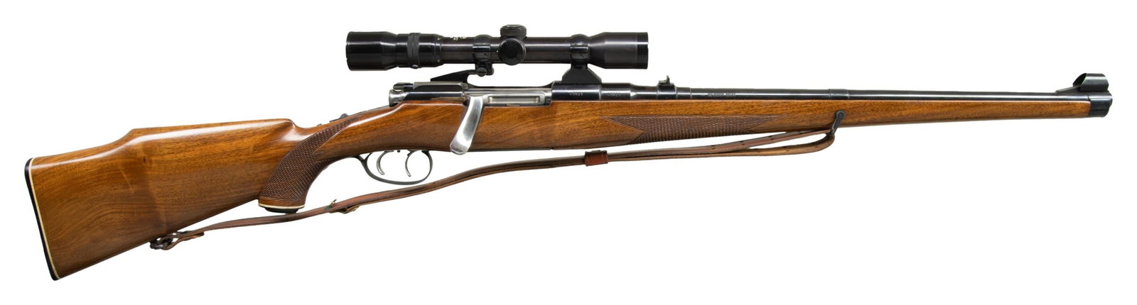 MANNLICHER SCHOENAUER 1961 MCA BOLT ACTION CARBINE: Cal 243 Win. S# 43621. 20" bbl with hooded ramp bead front sight and folding leaf rear sight. Kahles Heila 2.3-7x32 scope with fine crosshair reticle on Redfield 2 pc. mounts. Butter knife bolt