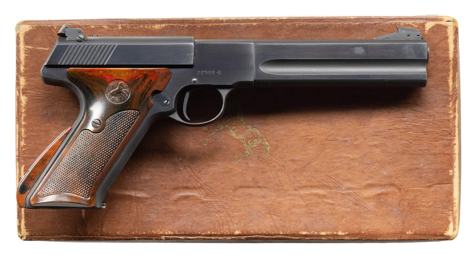 COLT WOODSMAN MATCH TARGET SEMI AUTO PISTOL WITH: COLT BOX. Cal. 22 LR. S# 22908-S. Mfg. 1949. Bbl. 6". Blade front sight & adj. rear sight. Blued finish. Brown plastic thumb rest grips. MAGS: 1 - 10 rd. UNATTACHED ACCESSORIES: Colt box w/ target & N