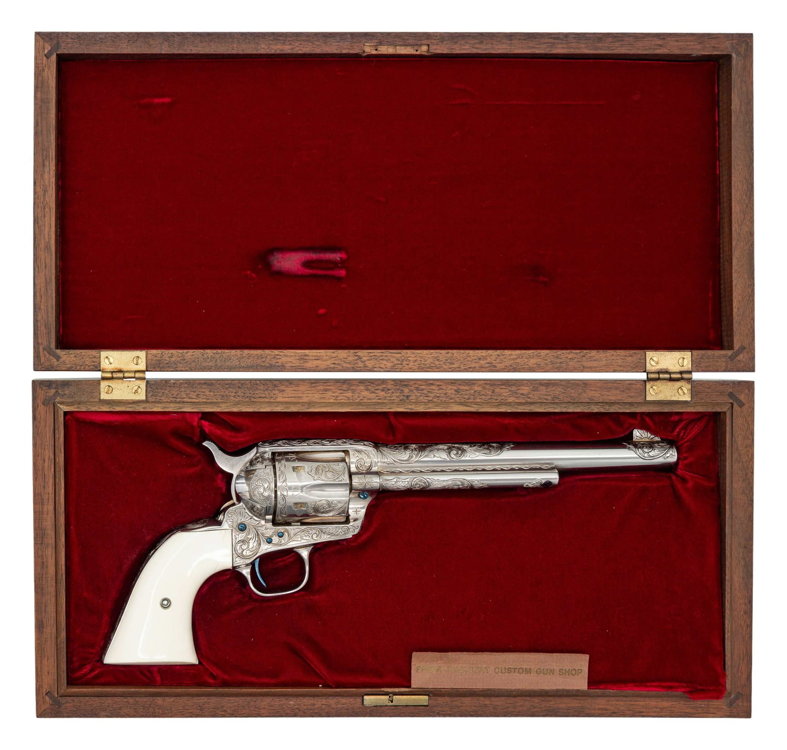 ATTRACTIVE CASED COLT SAA THIRD GENERATION TYPE: "C+" ENGRAVED REVOLVER. Cal. 44-40. S# S14782A. Bbl. 7 1/2". 6 Shot fluted cyl. Factory Custom Shop w/ 75% coverage of Type C engraving. Foliate vine type scroll engraving has stippled background w/ c