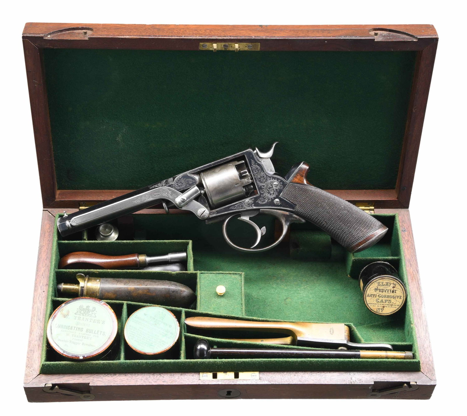 CASED & ENGRAVED TRANTER PATENT DA PERCUSSION: REVOLVER. Cal. 44. S# 20420T. Bbl. 6" octagon. Five shot round cyl. Frame, trigger guard, buttcap, loading lever & breech end of bbl. have vine type foliate scroll hand engraving w/ straight line bord