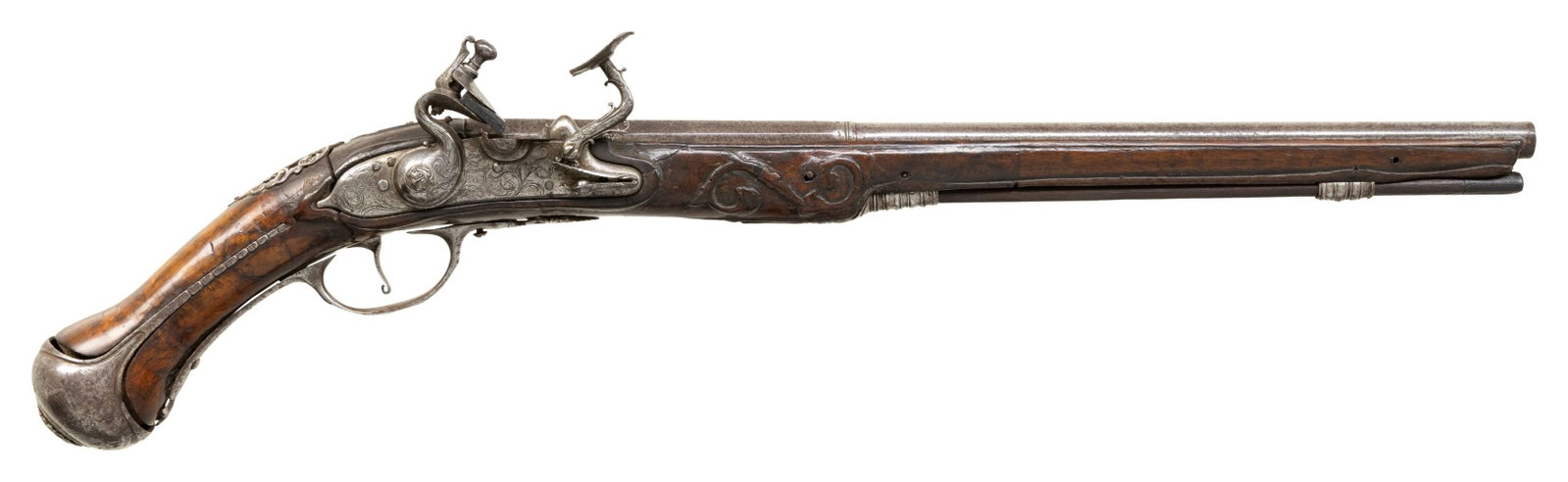 FINE RELIEF CHASED ITALIAN SNAPHAUNCE BELT PISTOL.: Cal. 40. NSN. The 14" half octagon, half round barrel is unmarked. Round bodied lock is fitted with well filed serpentine cock, inset rounded pan with sliding cover and snaphaunce frizzen filed with d