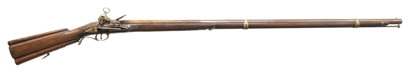 FINE & ATTRACTIVE SPANISH MIQUELET FOWLER.: Cal. 72. NSN. Circa 1800, 58" overall, 42.5" 3-stage tapered barrel, unknown maker poncoin at breech, full stock, classic Madrid style fluted butt stock with relief carved floral moldings, engraved