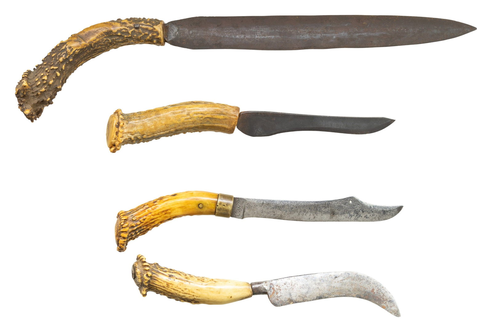 FOUR MARKED CROWN STAG GRIPPED PRIMITIVE AMERICAN: KNIVES. 1) 11" overall, 6.75" clip point blade, engraved "bird's head", signed initials on ricassos, crown stag handle with brass ferrule, silver collar around single pin. 2) 18" overall, 12" double