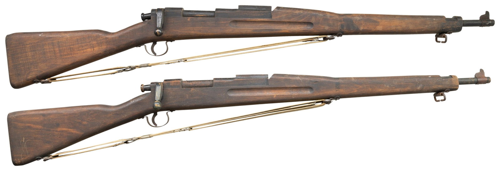 PAIR OF U.S. MODEL 1903 TRAINING / DRILL RIFLES.: Pair of U.S. training / drill rifles produced by Parris-Dunn Corp. to imitate the U.S. Springfield Model 1903. Rifles are comprised of painted wood, featuring a stamped steel front sights, sling