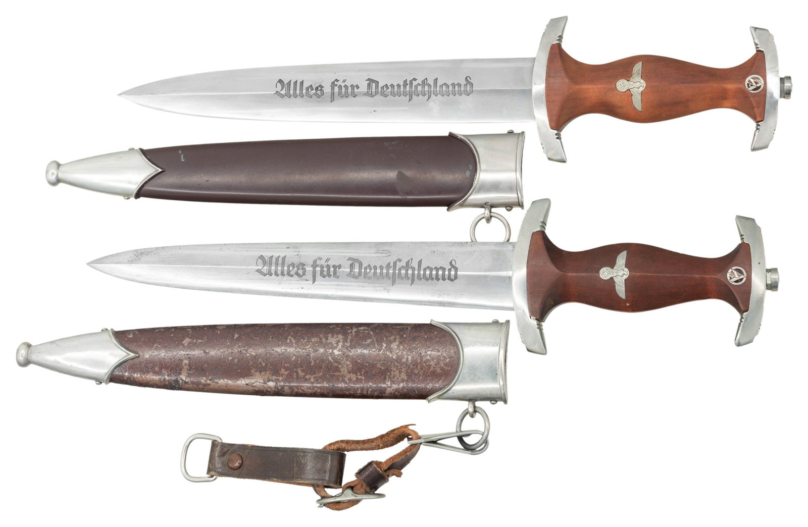 2 WWII GERMAN SA DAGGERS.: 1) WWII German SA dagger measuring 14 3/4" overall with a blade etched " Alles fur Deutschland " and marked " SUDD. MESSERFABRIK GEFREES ". Plated crossguard stamped " Fr " on the reverse with a