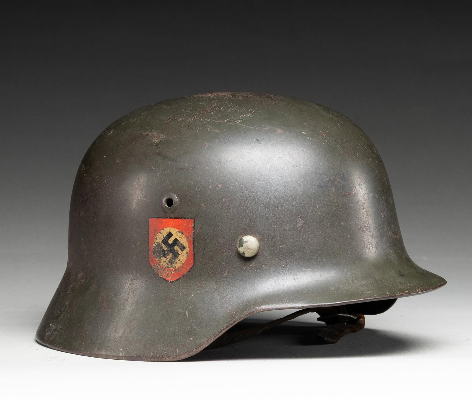 WWII GERMAN M35 POLICE HELMET.: WWII German M1935 Police double decal helmet having a dark green painted finish with a Police decal on the left side and a National decal on the right. The inside rear is stamped " D 150 " , and the