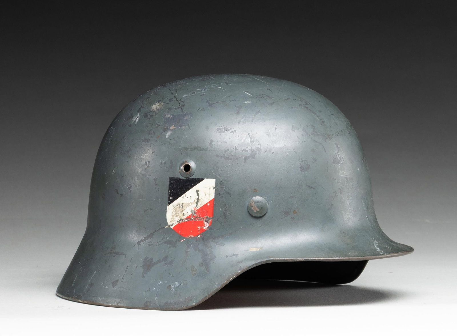 WWII GERMAN M35 LUFTWAFFE HELMET.: WWII German M1935 Luftwaffe double decal helmet having a blue / gray painted finish with a Luftwaffe decal on the left side and a National decal on the right. The inside rear is stamped " 3820 " ,