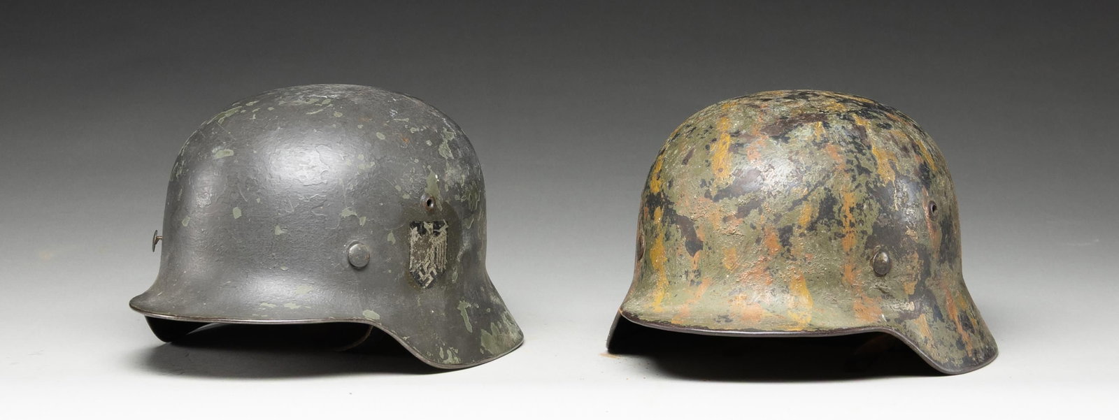 2 WWII GERMAN HELMETS. - 2