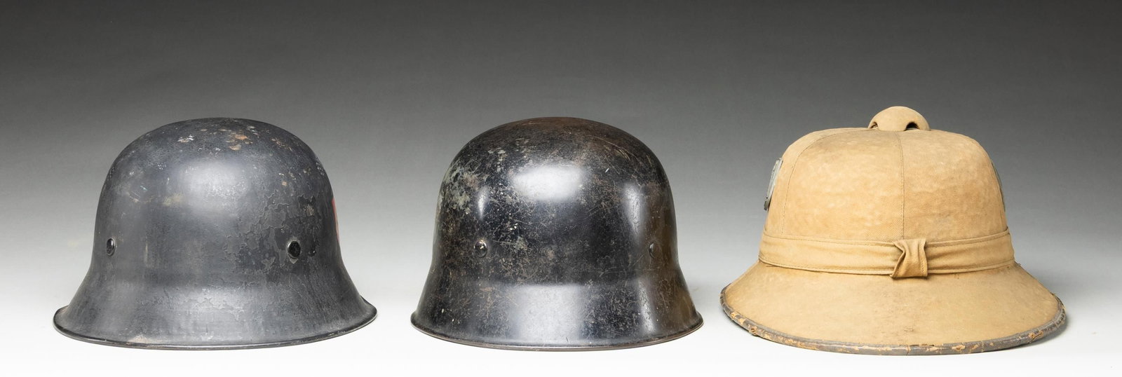 3 WWII GERMAN HELMETS. - 3