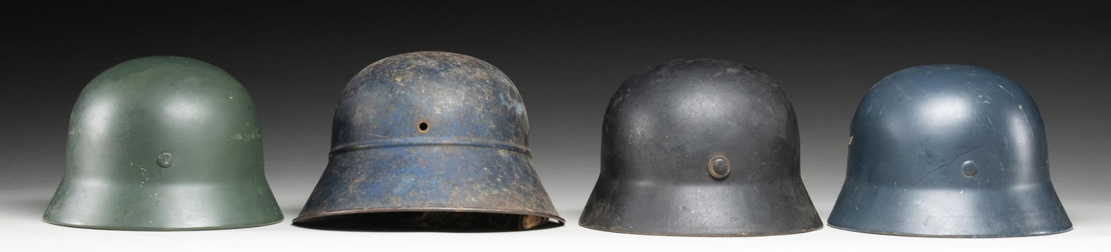 4 WWII GERMAN HELMETS. - 2