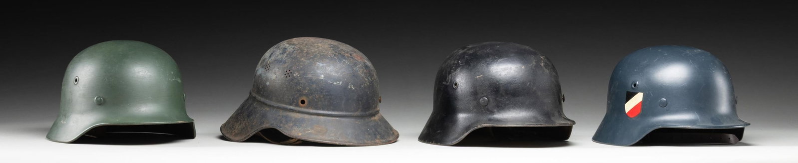 4 WWII GERMAN HELMETS. - 4