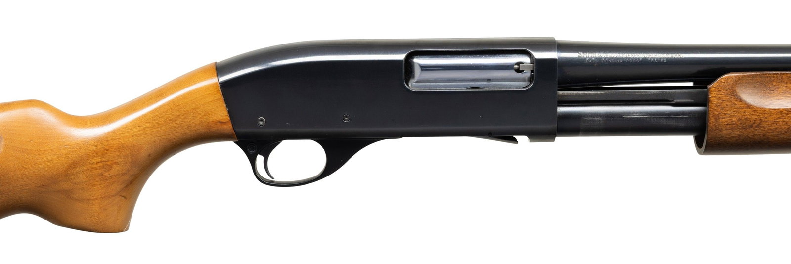 SMITH & WESSON 3000 POLICE PUMP ACTION RIOT: SHOTGUN. Cal. 12 Ga., 2 3/4". S# FB90590. Mfg. in Japan. Bbl. 18.5" w/ cyl. bore & steel bead. No. 47484 on frame. Hardwood stock set. CONDITION: very good to near excellent overall showing light cycl