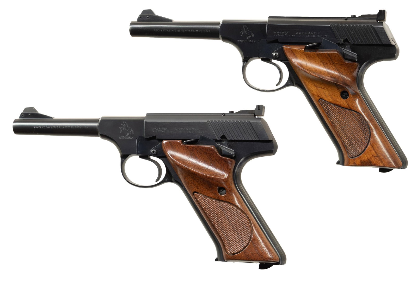 PAIR OF THIRD SERIES COLT WOODSMAN SEMI-AUTOMATIC: PISTOLS. 1) Cal. 22 LR. S# 191317-S. Bbl. 4 9/16". Third Series Woodsman semi-automatic pistol mfg. by Colt in 1960. Pistol exhibits standard factory markings. Metal components exhibit a reapplied blu