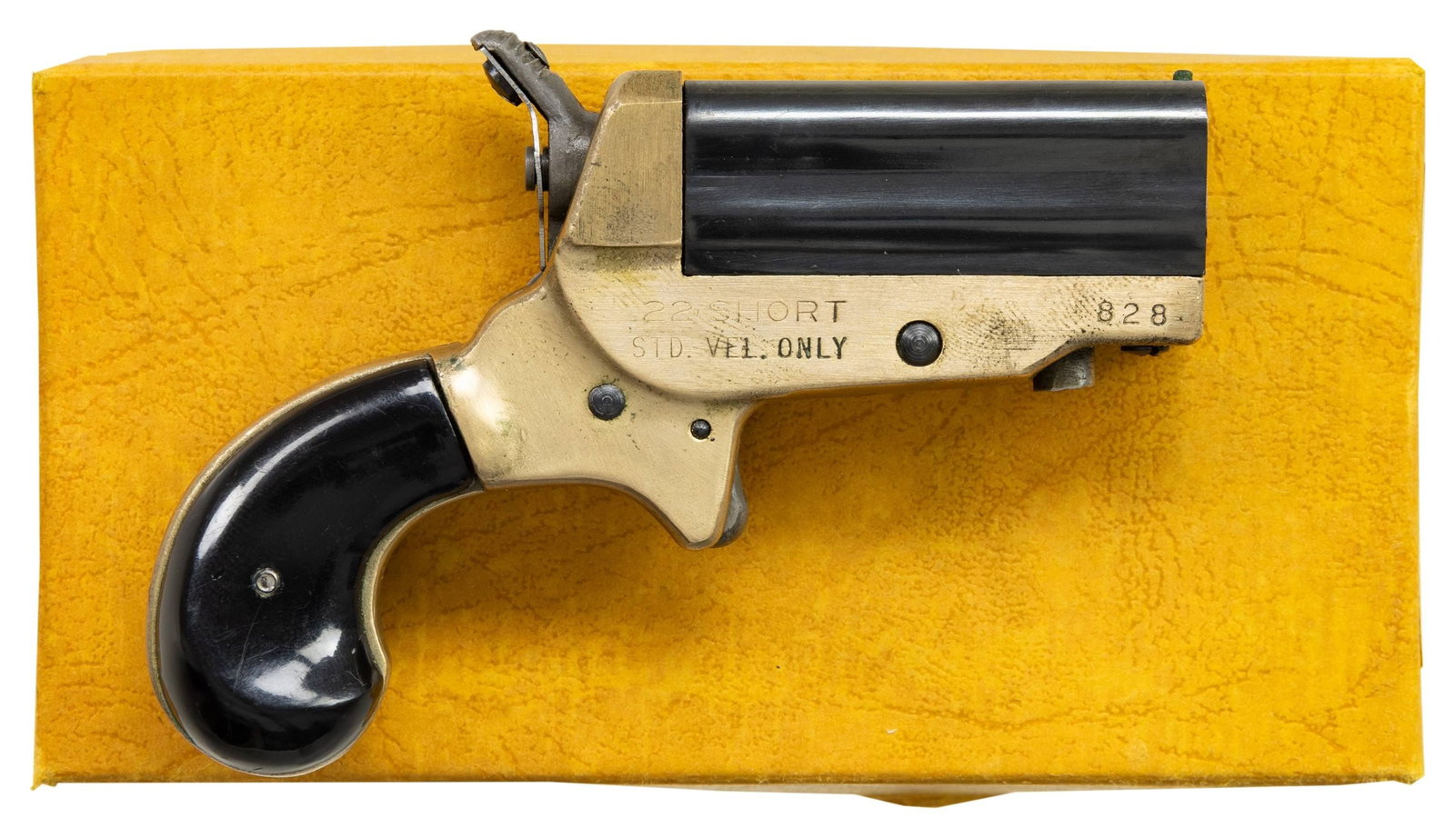 ERL SVENDSEN "FOUR ACES" DERRINGER WITH BOX.: Cal. 22 S. S# 828. Copy of Sharps derringer w/ 1.75" four bbl. cluster. Round butt brass frame with rosewood grips. UNATTACHED ACCESSORIES: factory box. CONDITION: very good overall appearance with li