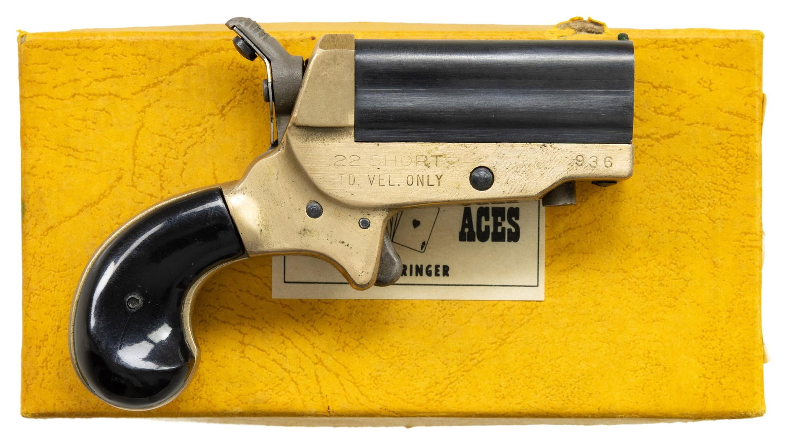 ERL SVENDSEN "FOUR ACES" DERRINGER WITH BOX.: Cal. 22 S. S# 936. Copy of Sharps derringer w/ 1.75" four bbl. cluster. Round butt brass frame with rosewood grips. UNATTACHED ACCESSORIES: factory box. CONDITION: very good overall appearance with li