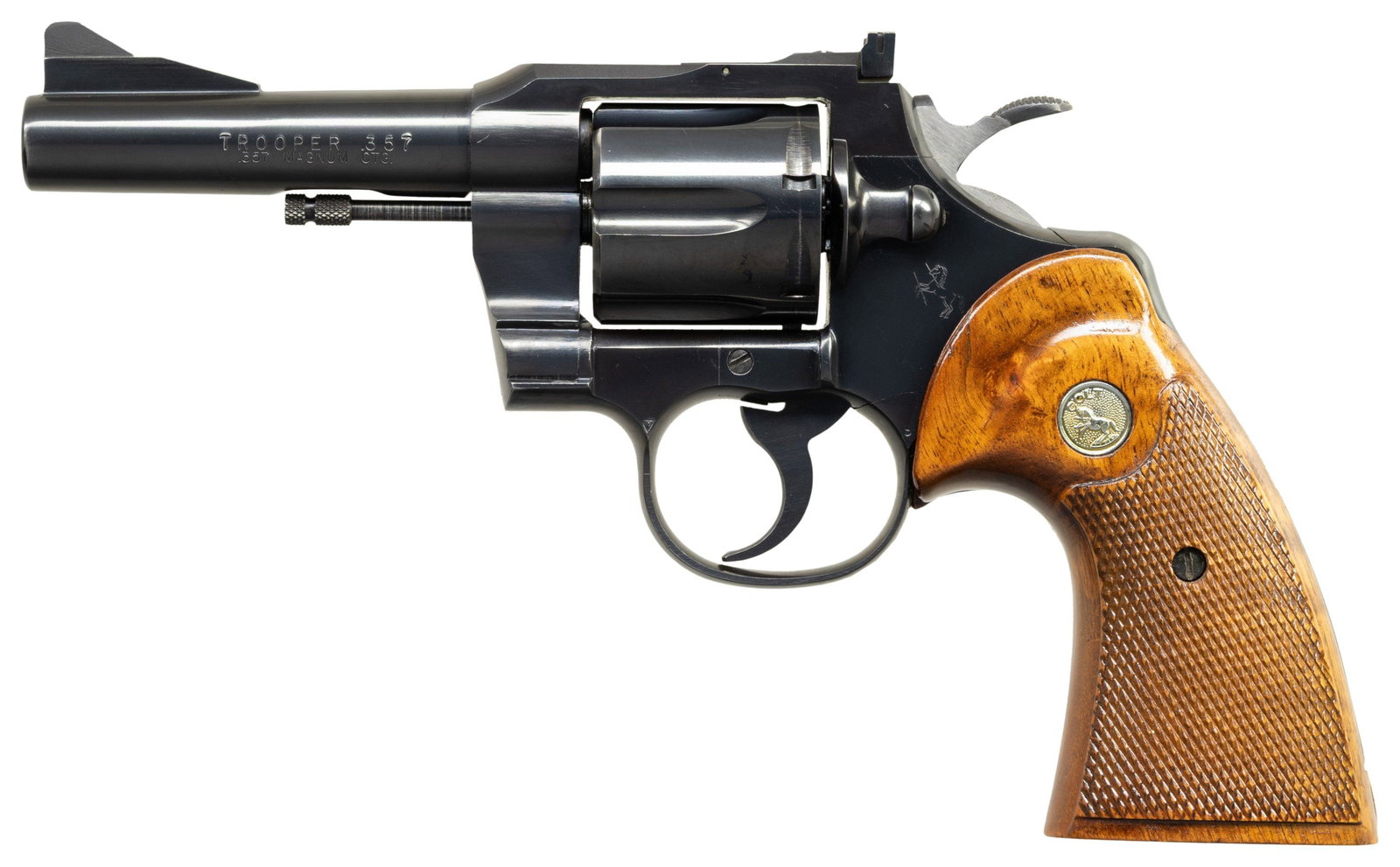 COLT TROOPER DOUBLE ACTION REVOLVER.: Cal. 357 Mag. S# 53670. Bbl. 4". Trooper double action revolver mfg. by Colt in 1966. Left side of the bbl. is marked with the model and cal. designations, with Colt's single line address marked on th