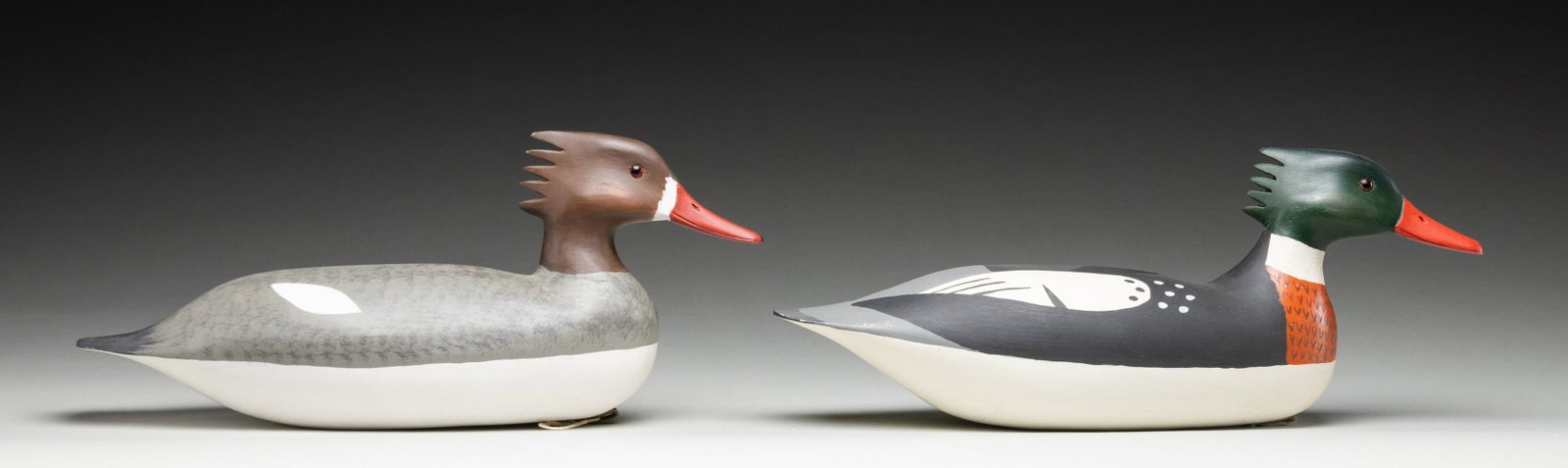 2 HV SHOURDS MEGANSER WOOD DECOYS: Pair of decoys measuring approx.16" w/ 7" height; 1 dated 1981. CONDITION: near excellent overall. (02-26774/MD). NON-GUN. $300-400.