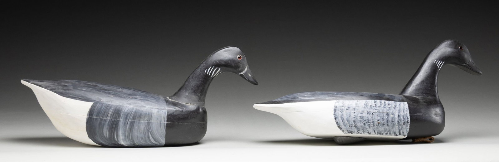 2 ROBERT HOLZWORTH OF SOLON, MAINE BRANT GOOSE: WOOD DECOYS. Both approx. 18" overall w/ 8" in height. CONDTION: both appear very good overall showing light dings & lightly fading paint. (02-26775/MD). NON-GUN. $100-300.