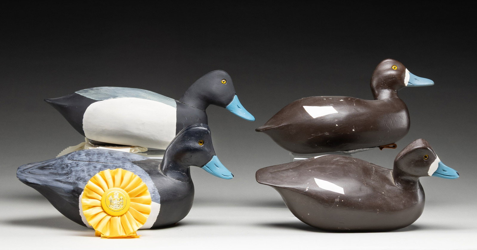 4 ROBERT HOLZWORTH OF SOLON, MAINE BLUEBILL: HUNTING DIVING DECOYS. All approx. 14" overall w/ 7.5" height. 2 are Hens with the 2 Drakes being award winning: A 3rd place in the 1985 State of Maine Sportsman's Show Wildlife carving contest & An h