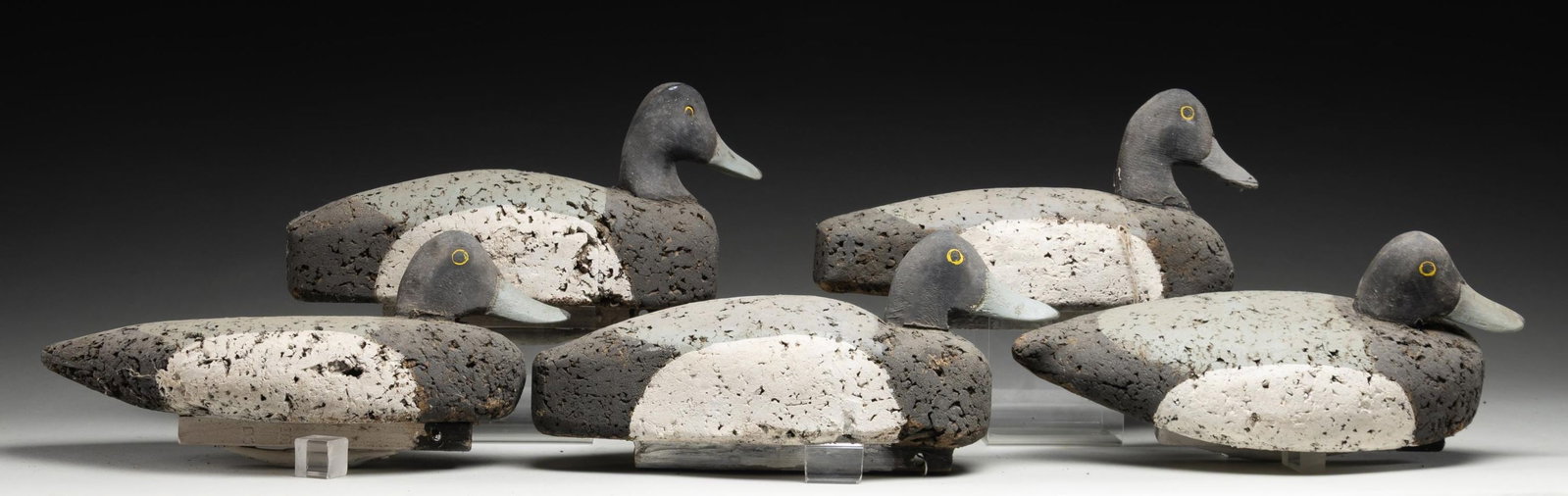 5 ROBERT HOLZWORTH WOOD DUCK CORK DECOYS.: All approx. 14" overall w/ 6.5" height. CONDITION: fair overall with age related loss of paint, cracking in cork & storage residue. (02-26794/MD). NON-GUN. $100-300.