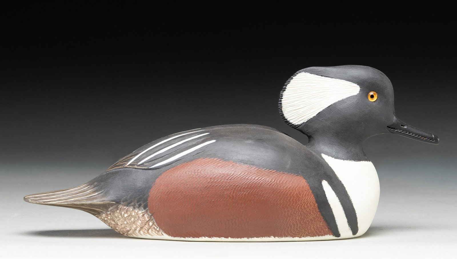 DELBERT "CIGAR" DAISY MALE HOODED MERGANSER WOOD: HUNTING DECOY. Approx. 13" overall w/ 6" height. CONDITION: appears near excellent. (02-26779/MD). NON-GUN. $200-300.